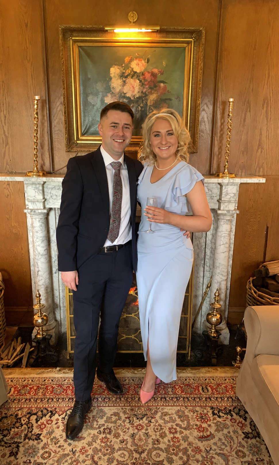 Laura and Kieran smiling together at a celebration